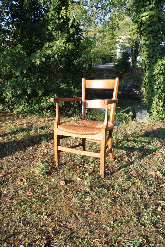 Antique armchair made of wood and straw