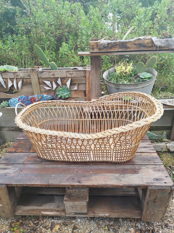 Antique wicker rattan cradle from the 60s 