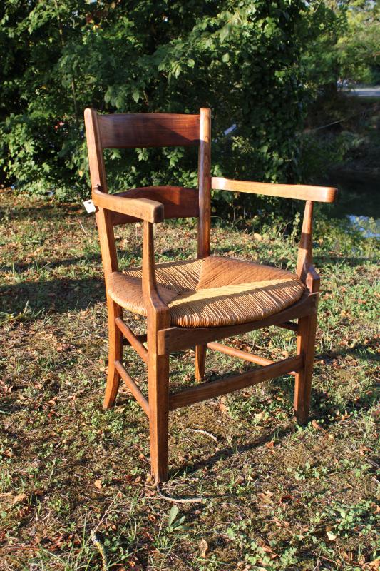 Antique armchair made of wood and straw