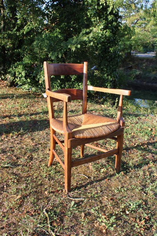 Antique armchair made of wood and straw