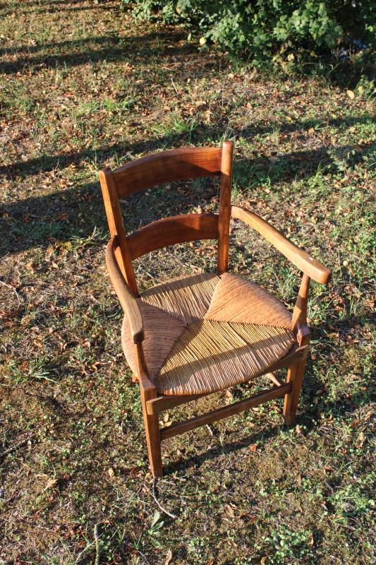 Antique armchair made of wood and straw