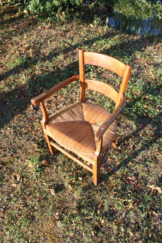 Antique armchair made of wood and straw