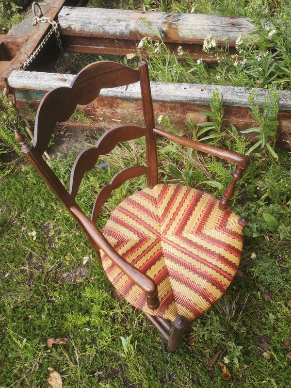 Old red straw armchair