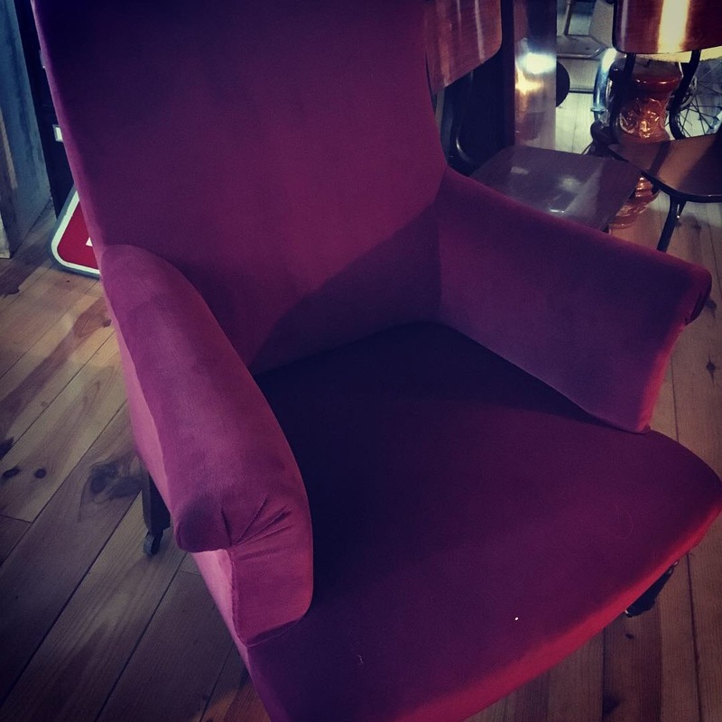 Old red velvet armchair