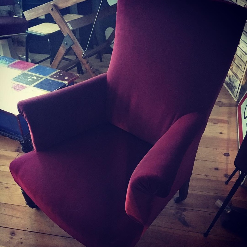 Old red velvet armchair