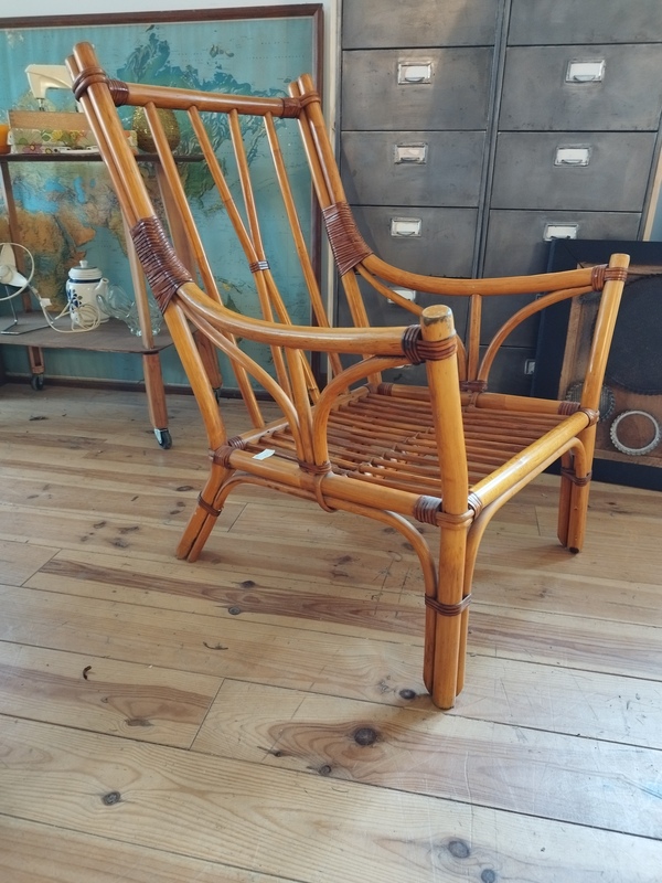 Rattan armchair and leather straps