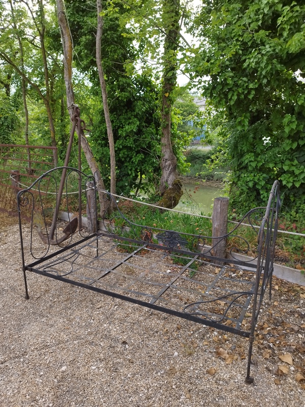 Old art deco wrought iron bed