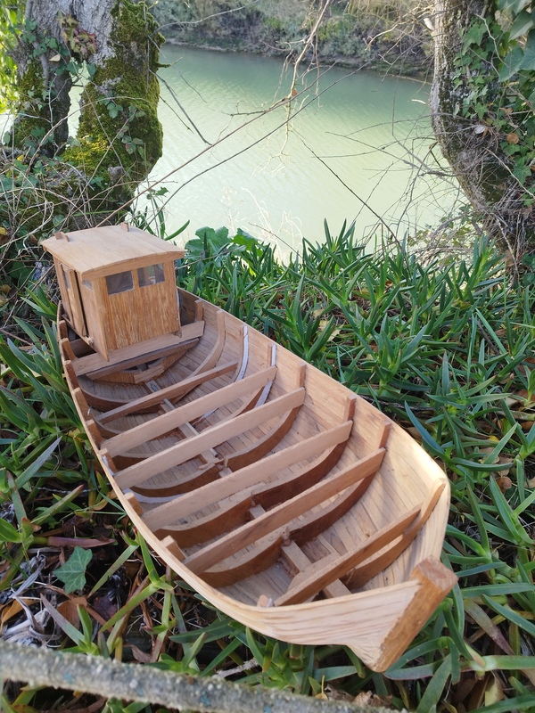 Wooden fishing boat model.