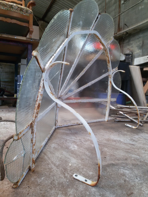 Wrought iron and reinforced glass canopy