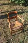 Antique armchair made of wood and straw