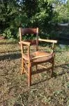Antique armchair made of wood and straw