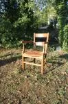 Antique armchair made of wood and straw