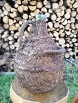 Antique braided wicker demijohn