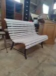 Outdoor bench made of wood and wrought iron