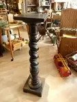 Blackened wooden column for statue