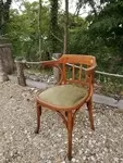 Curved wood armchair
