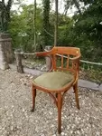 Curved wood armchair