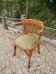 Curved wood armchair