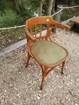 Curved wood armchair