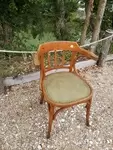 Curved wood armchair