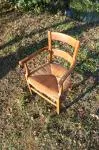 Antique armchair made of wood and straw