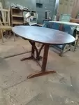 Folding oval table