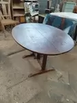 Folding oval table