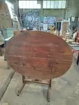 Folding oval table