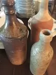 Lot of three bottles 19th in terracotta and gre