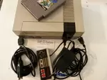 Nintendo NES, cables and a game