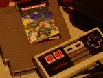 Nintendo NES, cables and a game