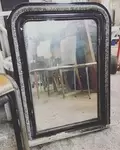 Old black mirror and silver decor