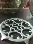 Old enamelled cast iron trivet