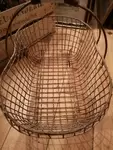 Old fishing basket with feet