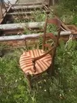 Old red straw armchair