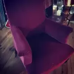 Old red velvet armchair