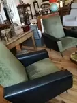 Pair of 60s black skai and green velvet armchairs