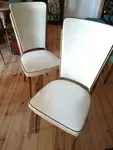 Pair of chairs in white skai