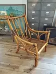Rattan armchair and leather straps