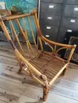 Rattan armchair and leather straps