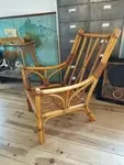 Rattan armchair and leather straps