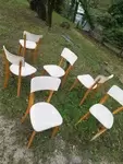Set of six wood and white skai chairs