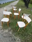 Set of six wood and white skai chairs