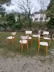 Set of six wood and white skai chairs