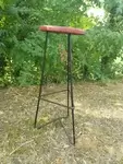 Black lacquered metal stool