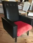 Upholstered black leather chair