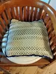 Vintage feather and crochet cushion