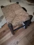 Wood and straw cowherd stool