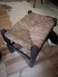 Wood and straw cowherd stool