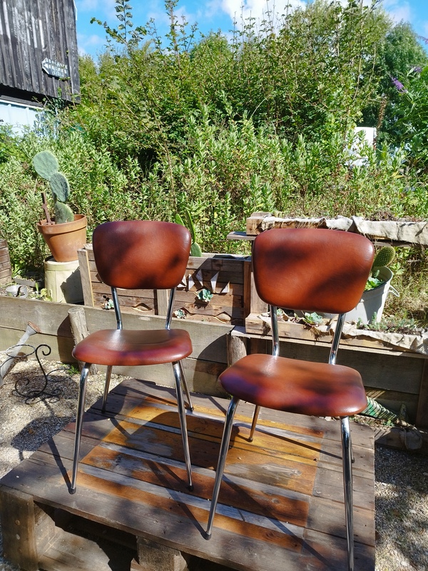 Pair of vintage chrome and skai chairs 
